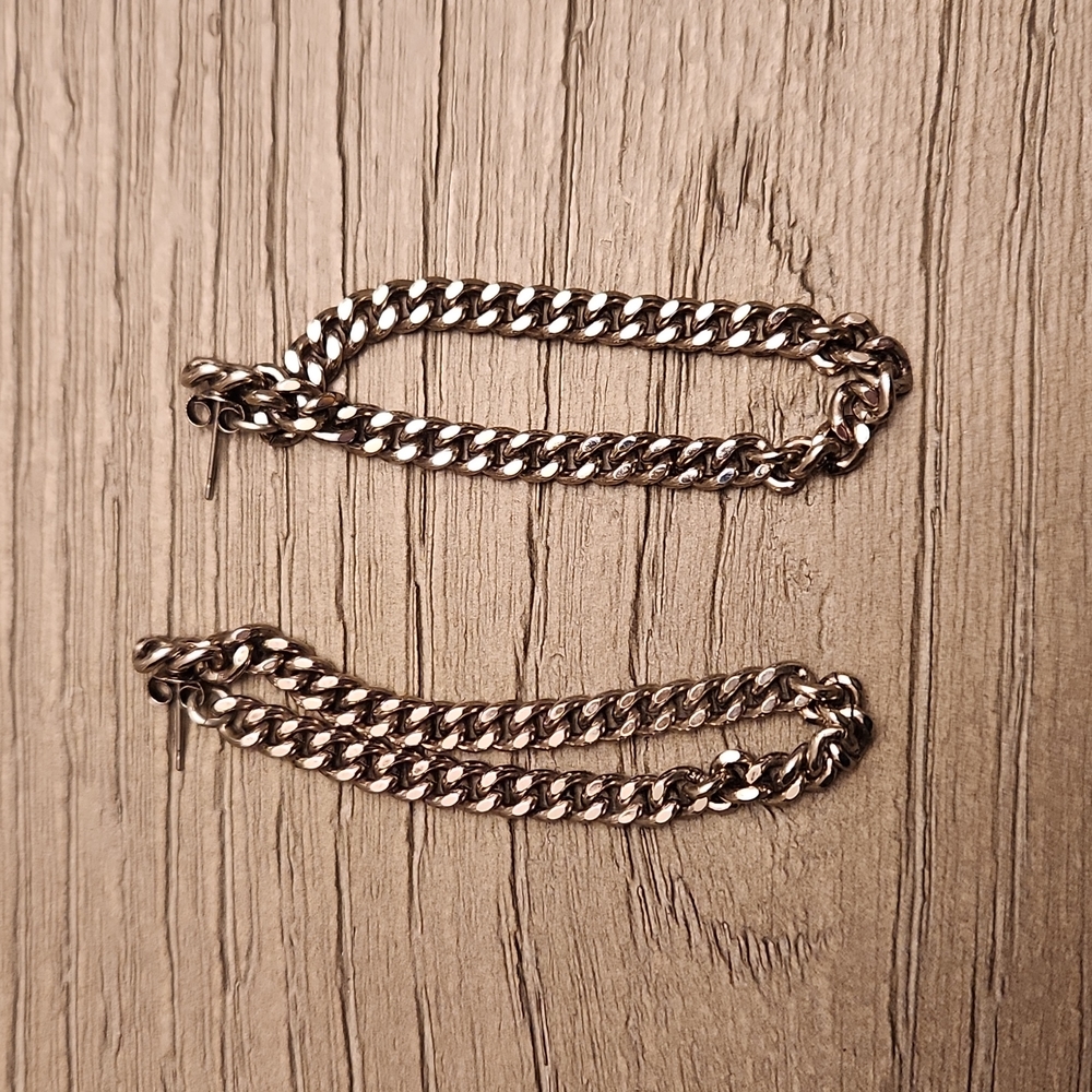 Silver metal dangling earrings